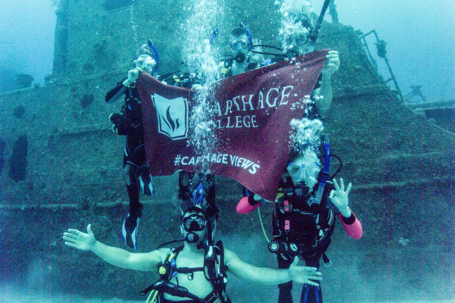Underwater exploration: Students scuba dive in Honduras for the J-Term study tour Biodiversity, Brains and Behavior.