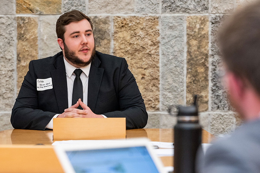 A student dressed in a suit for an interview.