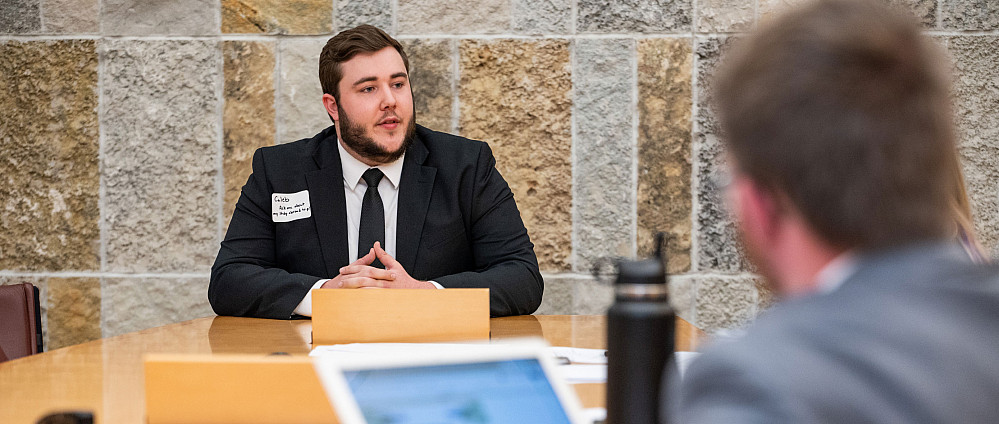 Career Preparation Banner A student dressed in a suit for an interview.