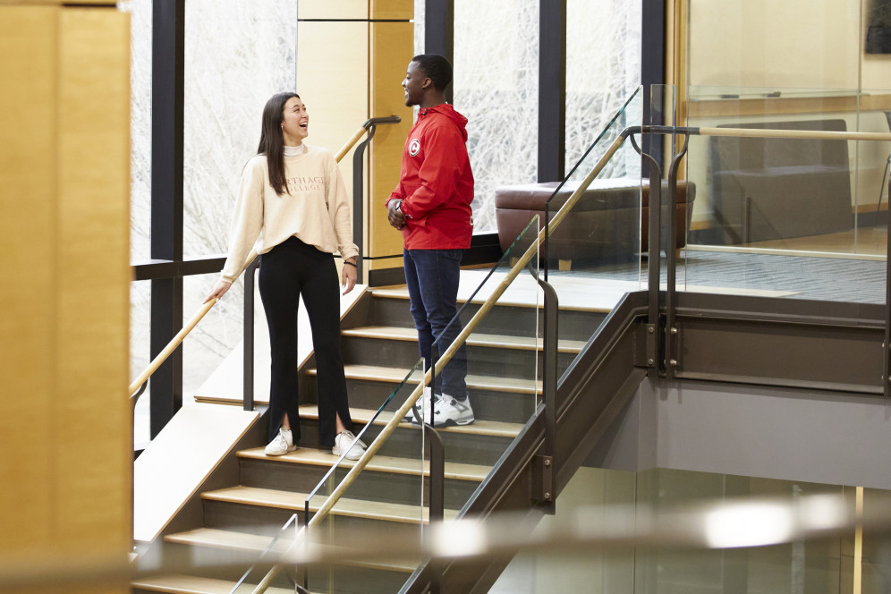 Students talking in the Clausen Center.