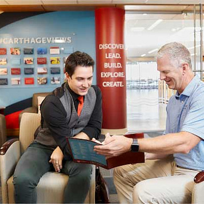 A prospective student meeting with an advisor in the Office of Admissions.