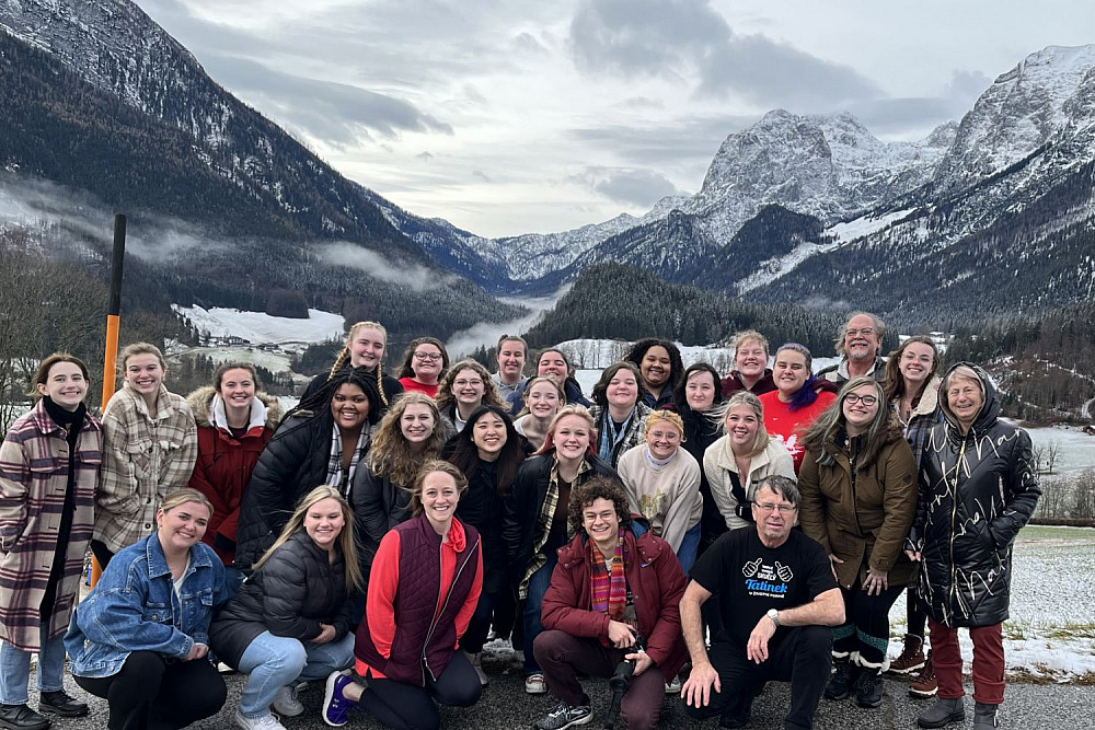 Students posing in front of mountains in Sweden