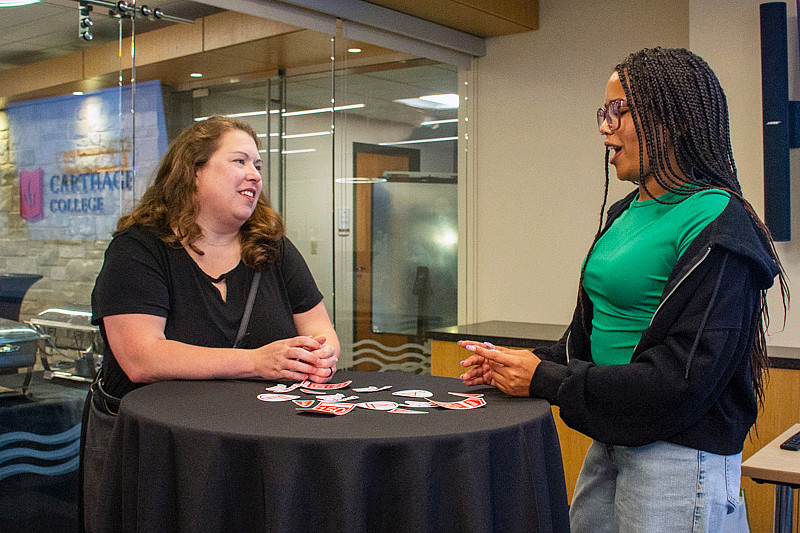 Carthage mentor Jessica Safransky speaks to a mentee 