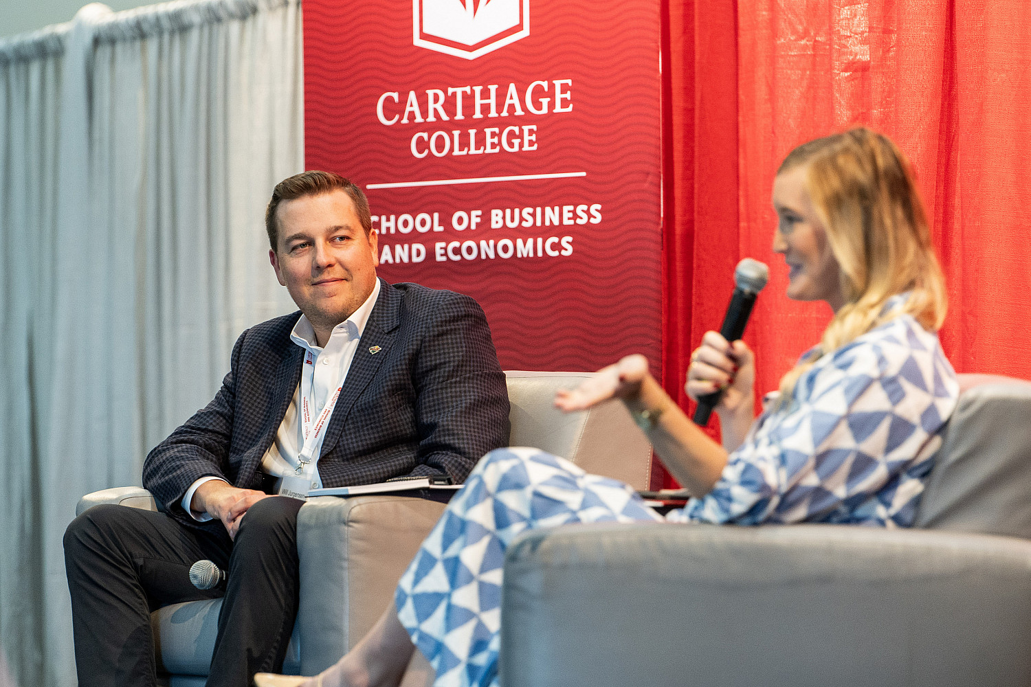 Carthage grad Will Jurgensen '21 speaks at a business event at Carthage.