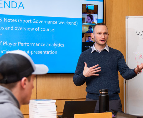 Prof. Carter Rockhill teaching a sports management course.