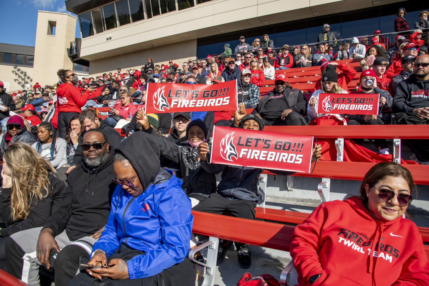 Firebirds fans cheer during the Homecoming football game.
