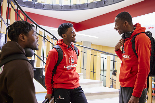 Three students conversing