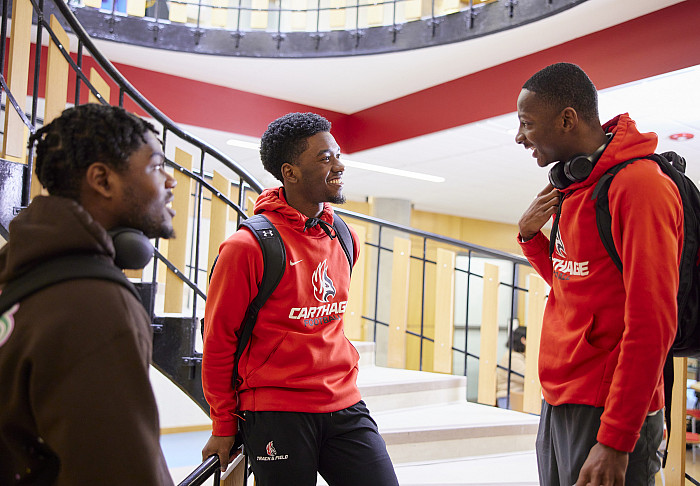 Three students conversing