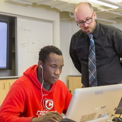 Prof. Daniel Steiner assists a student during class.