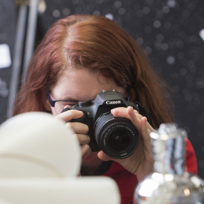 Students take photos in a photography course.