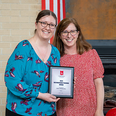 Professor Nina Weisling, left, of the Education Department won the Distinguished Teaching Award for 2023-24. She is shown with previous w...